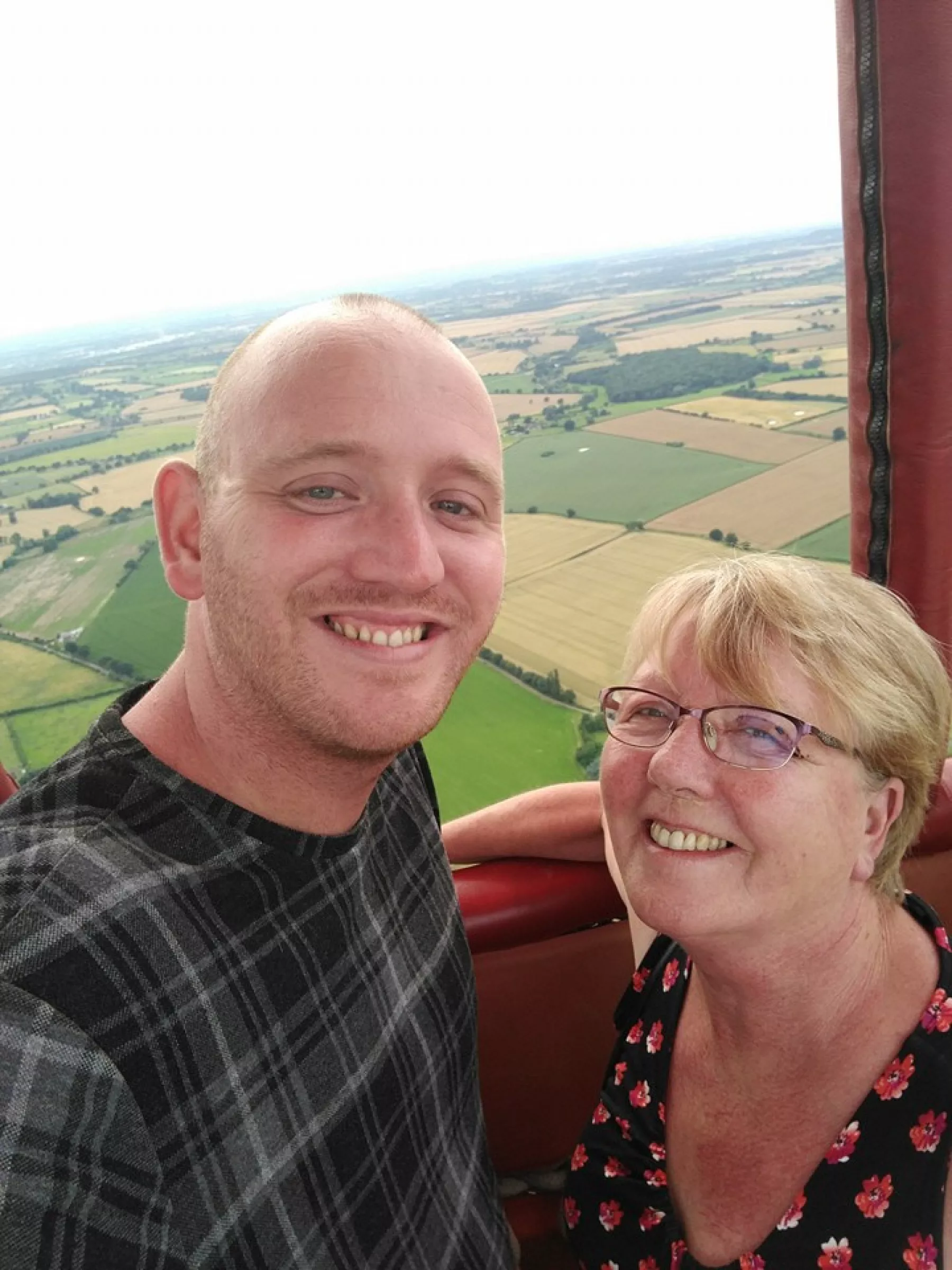 Mother and son enjoying a hot air balloon ride